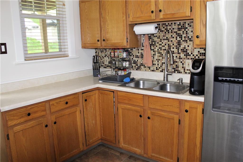 3545 Library Road Pittsburgh, PA 15234 - Photo 11 of 25 a kitchen with window and cabinets