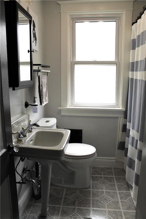 3545 Library Road Pittsburgh, PA 15234 - Photo 17 of 25 a bathroom with a sink a toilet and a mirror