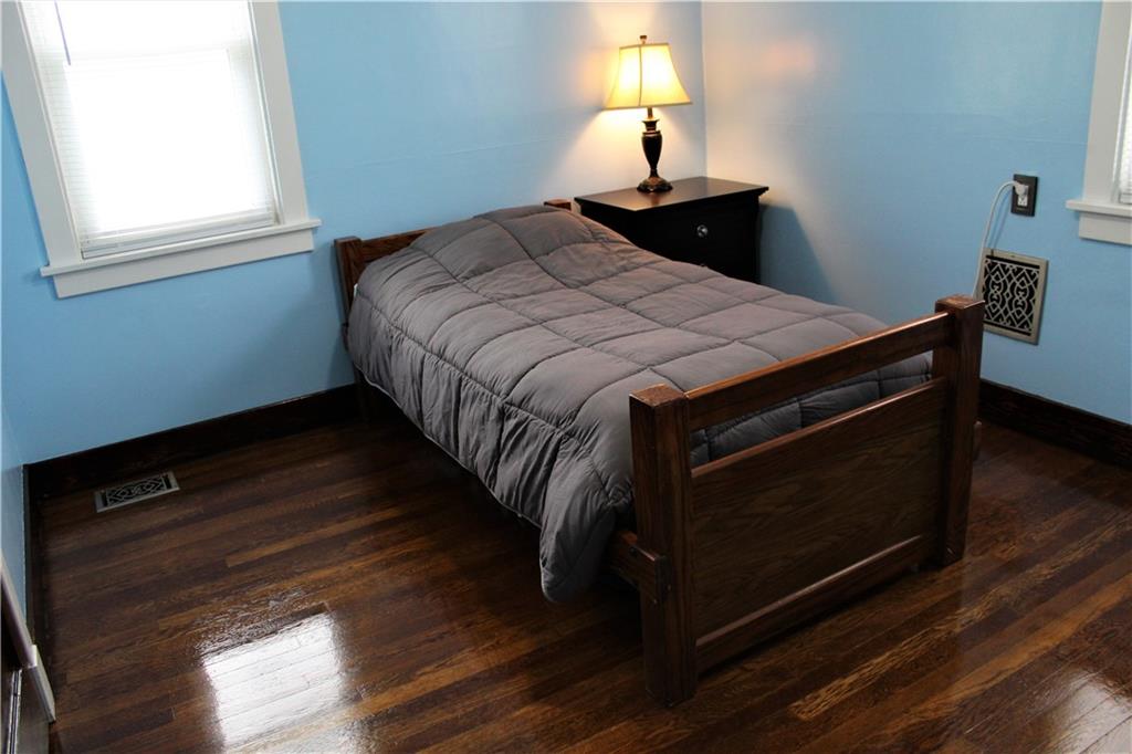 3545 Library Road Pittsburgh, PA 15234 - Photo 18 of 25 a bed sitting in a bedroom next to a window