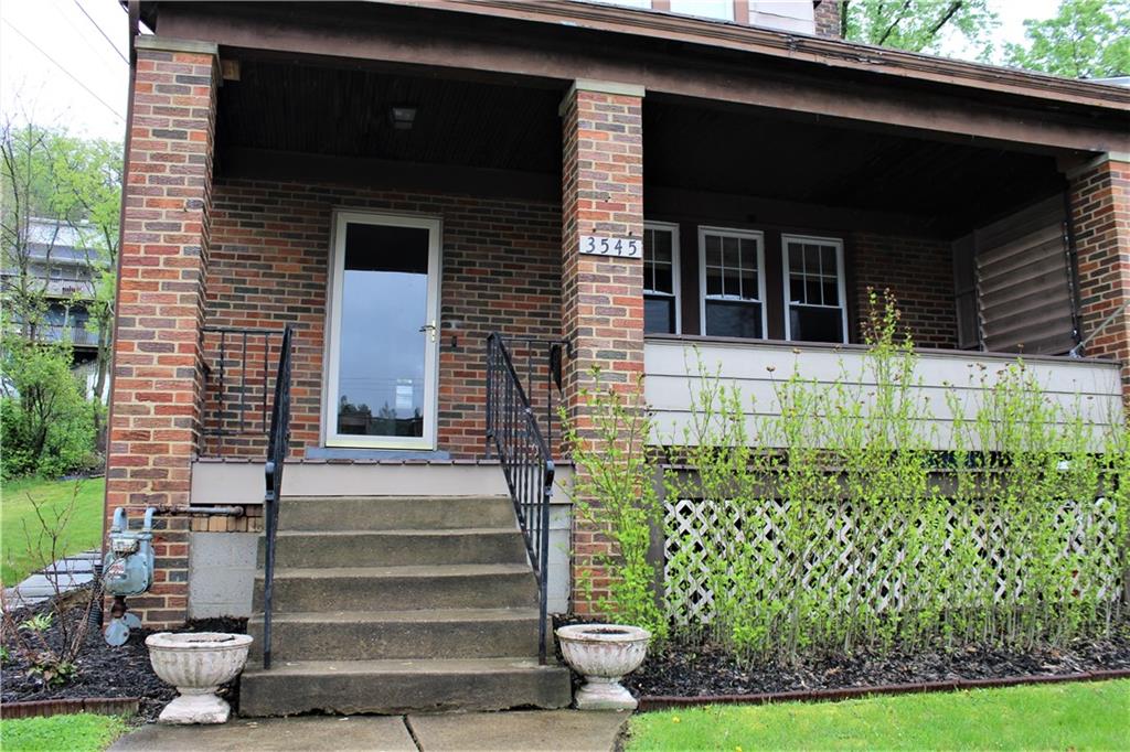 3545 Library Road Pittsburgh, PA 15234 - Photo 2 of 25 a front view of a house with a garden