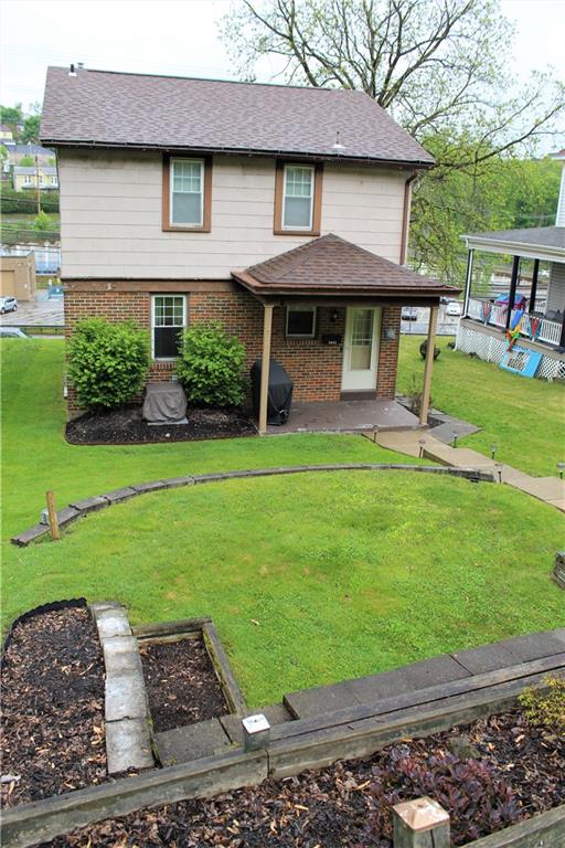 3545 Library Road Pittsburgh, PA 15234 - Photo 25 of 25 a front view of a house with a garden