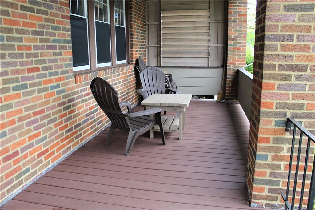 3545 Library Road Pittsburgh, PA 15234 - Photo 3 of 25 a view of a balcony with table and chairs