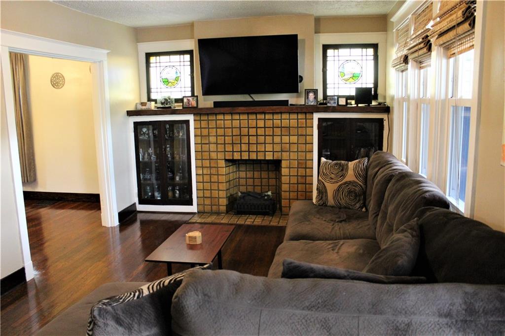 3545 Library Road Pittsburgh, PA 15234 - Photo 4 of 25 a living room with furniture and a flat screen tv