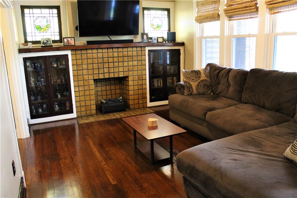 3545 Library Road Pittsburgh, PA 15234 - Photo 5 of 25 a living room with furniture fireplace and flat screen tv
