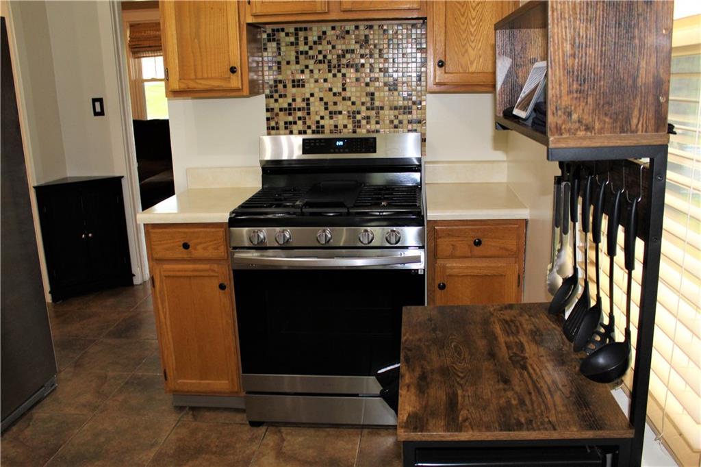 3545 Library Road Pittsburgh, PA 15234 - Photo 10 of 25 a kitchen with a stove and a cabinet