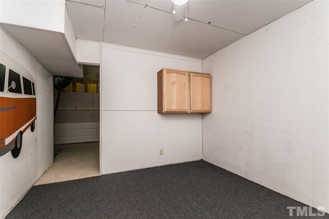 1317 Silver Beach Way Raleigh, NC 27606 - Photo 22 of 24 a view of a refrigerator and a microwave in a room