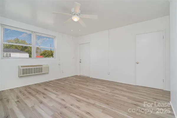 a view of an empty room with a window