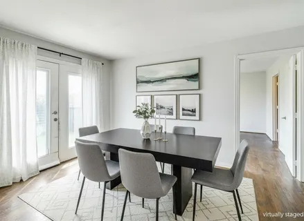 a view of a dining room with furniture and window