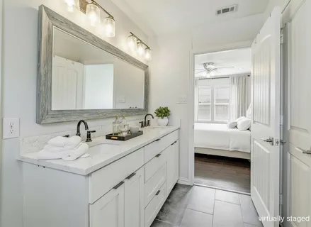 a bathroom with a sink a vanity and a mirror