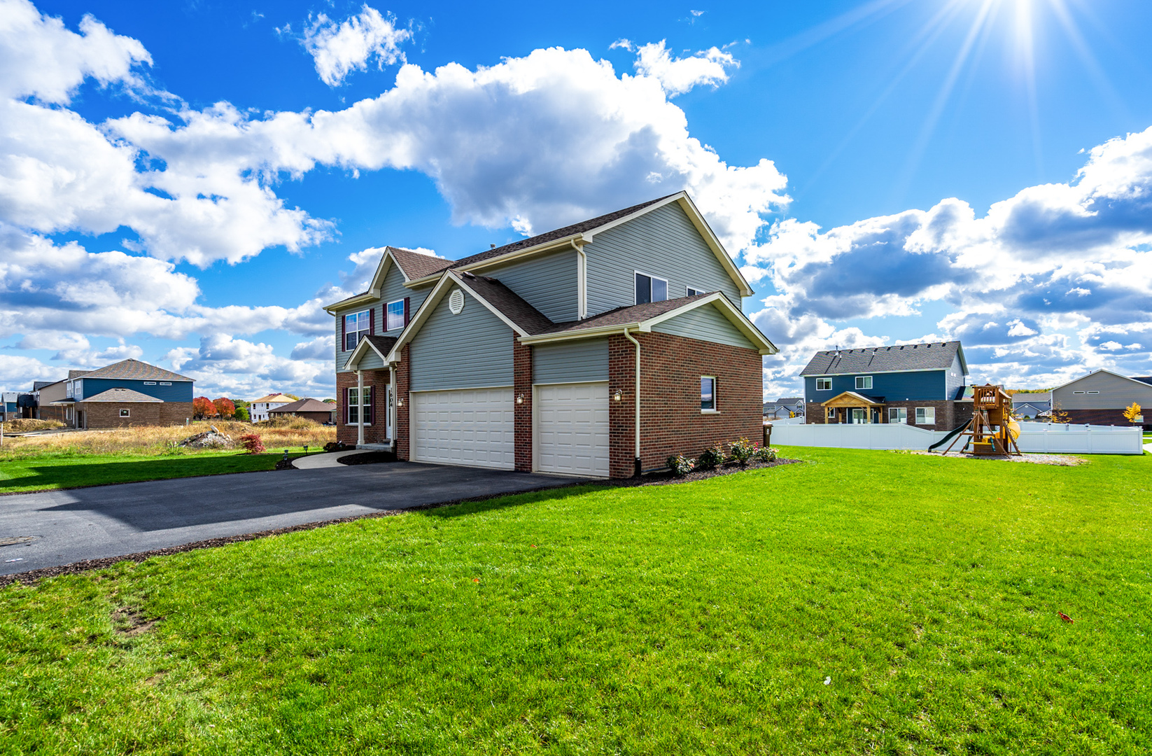1604 Edentenny Road New Lenox, IL 60451 - Photo 1 of 37 a front view of a house with a yard and garage