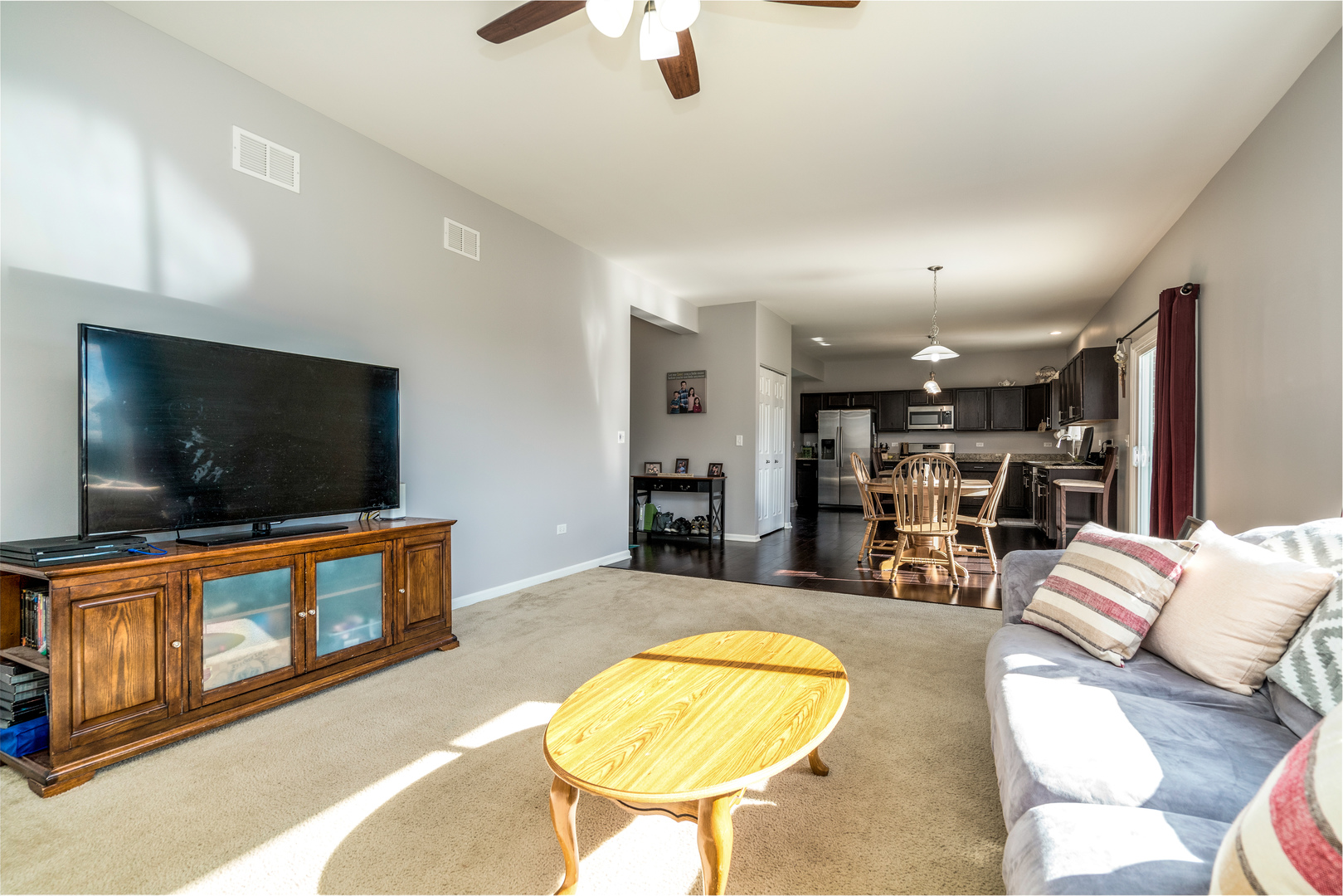 1604 Edentenny Road New Lenox, IL 60451 - Photo 11 of 37 a living room with furniture and a flat screen tv