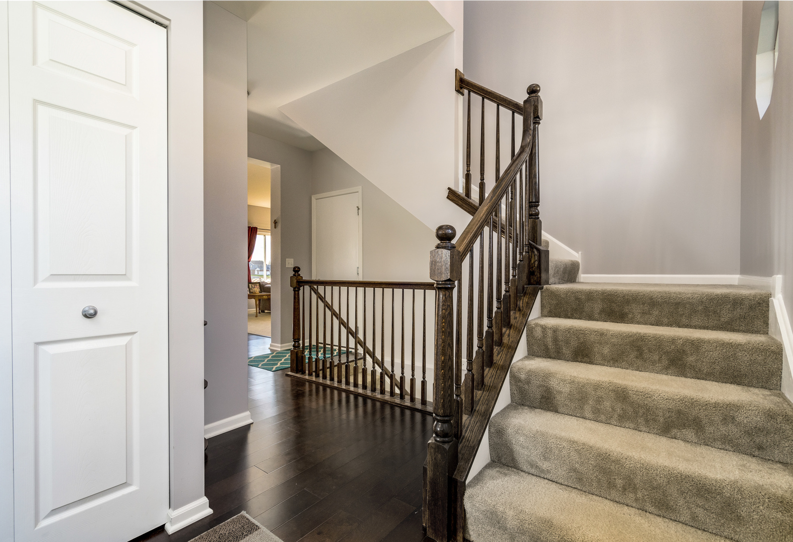 1604 Edentenny Road New Lenox, IL 60451 - Photo 14 of 37 a view of staircase with lots of frames on wall