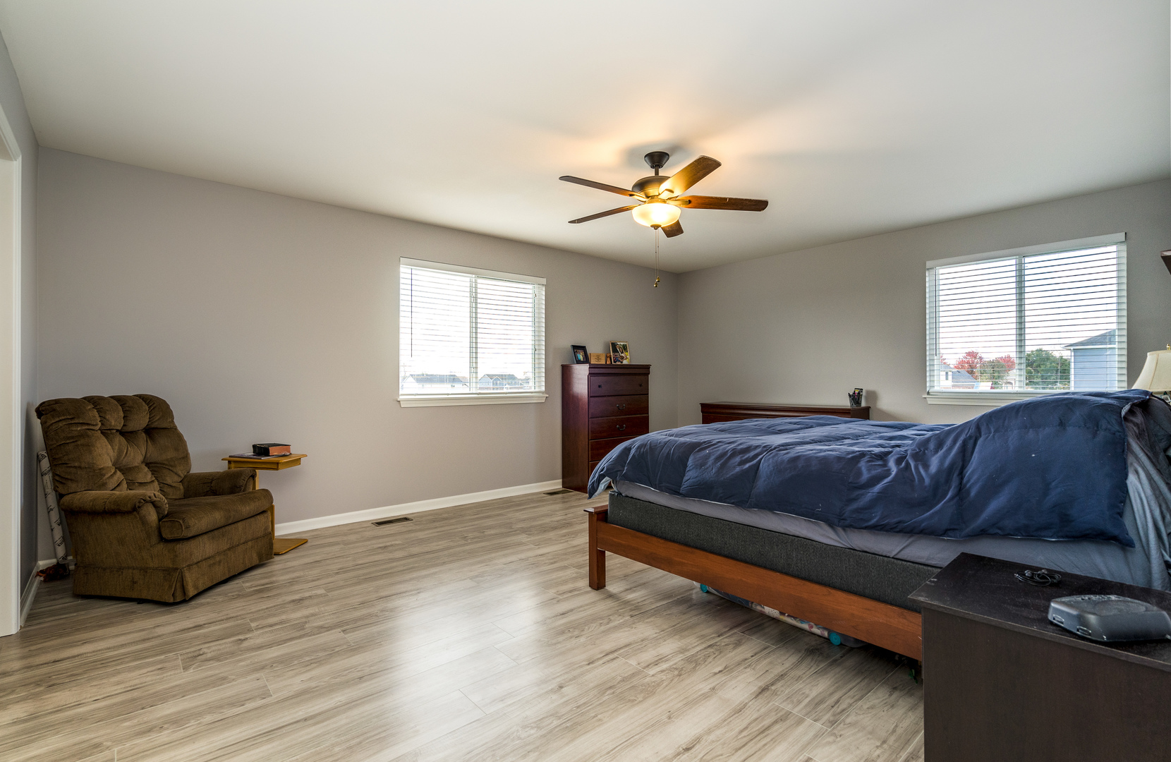 1604 Edentenny Road New Lenox, IL 60451 - Photo 17 of 37 a spacious bedroom with a bed and wooden floor