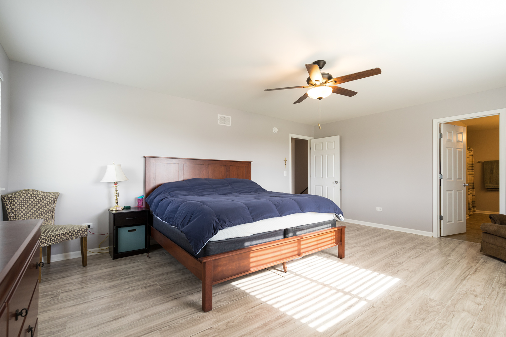 1604 Edentenny Road New Lenox, IL 60451 - Photo 18 of 37 a bedroom with a bed and wooden floor