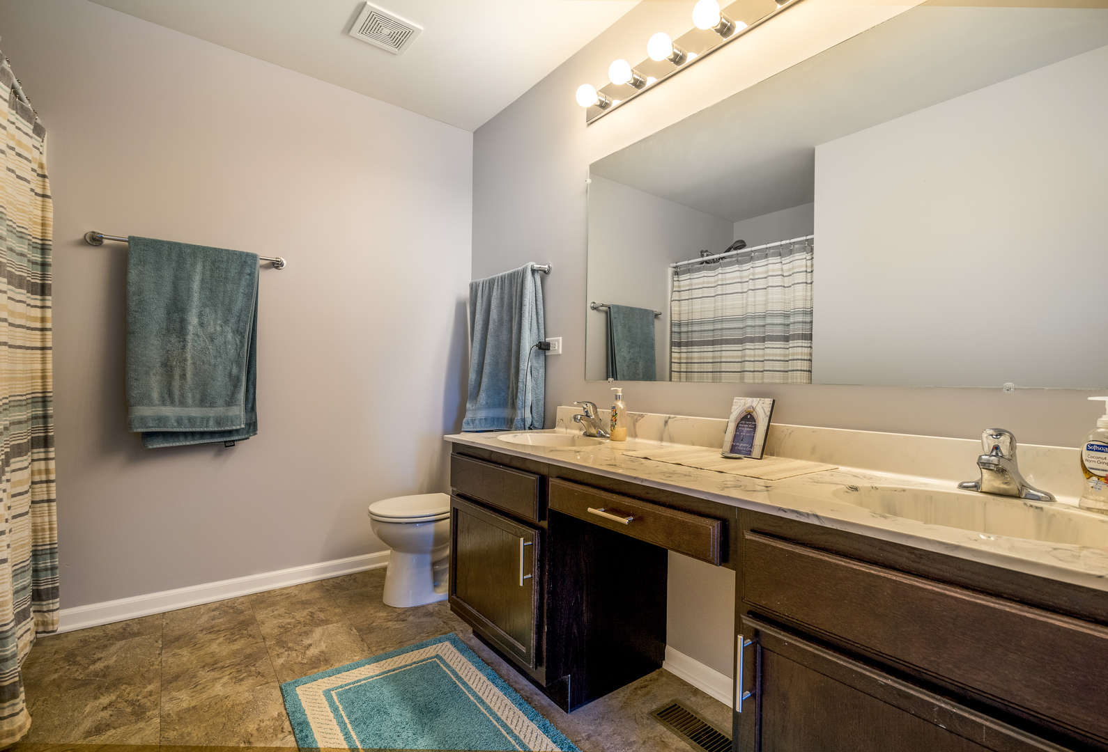 1604 Edentenny Road New Lenox, IL 60451 - Photo 19 of 37 a spacious bathroom with a granite countertop sink a toilet and a mirror