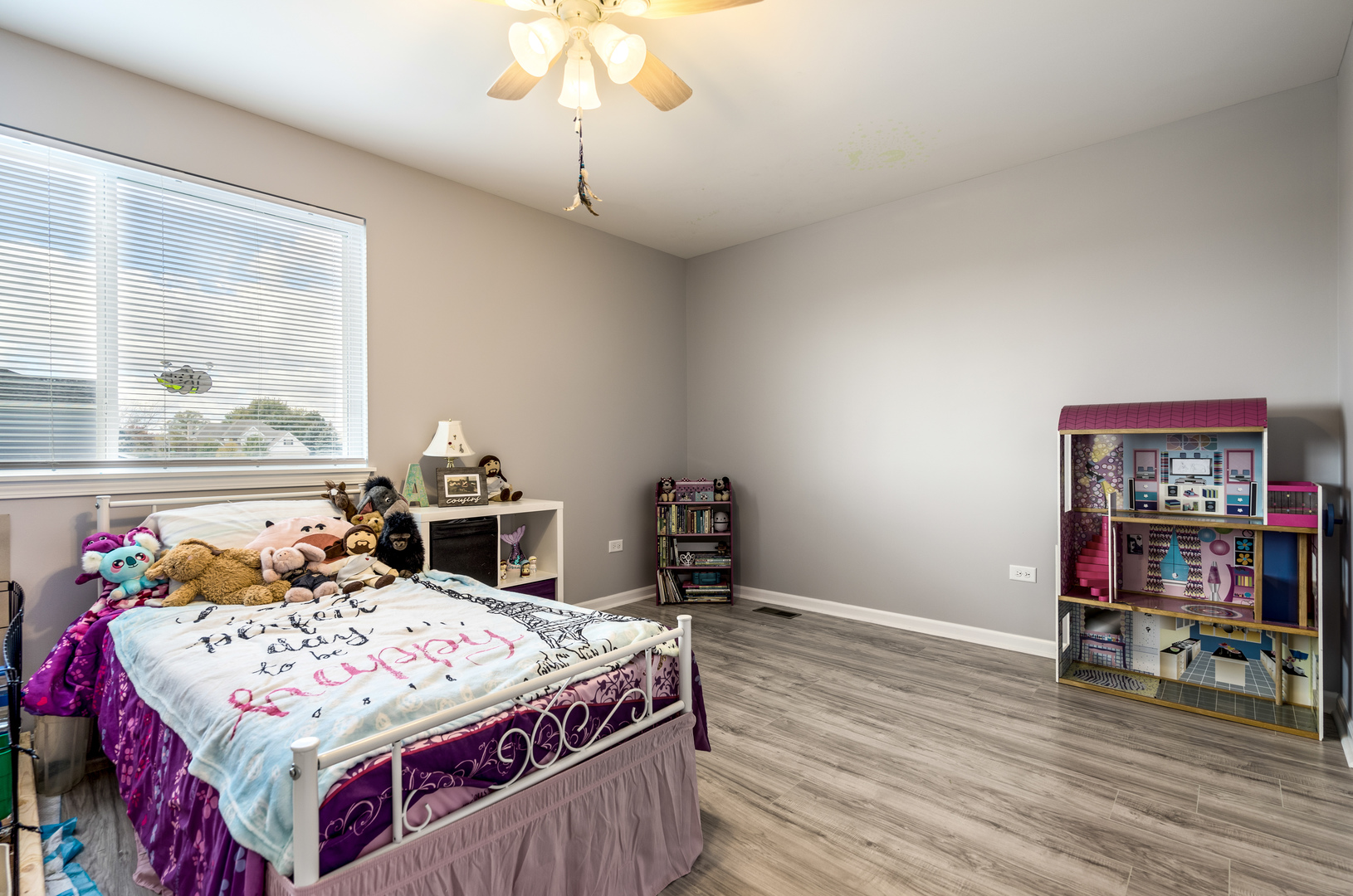 1604 Edentenny Road New Lenox, IL 60451 - Photo 21 of 37 a bedroom with a bed and a book shelf