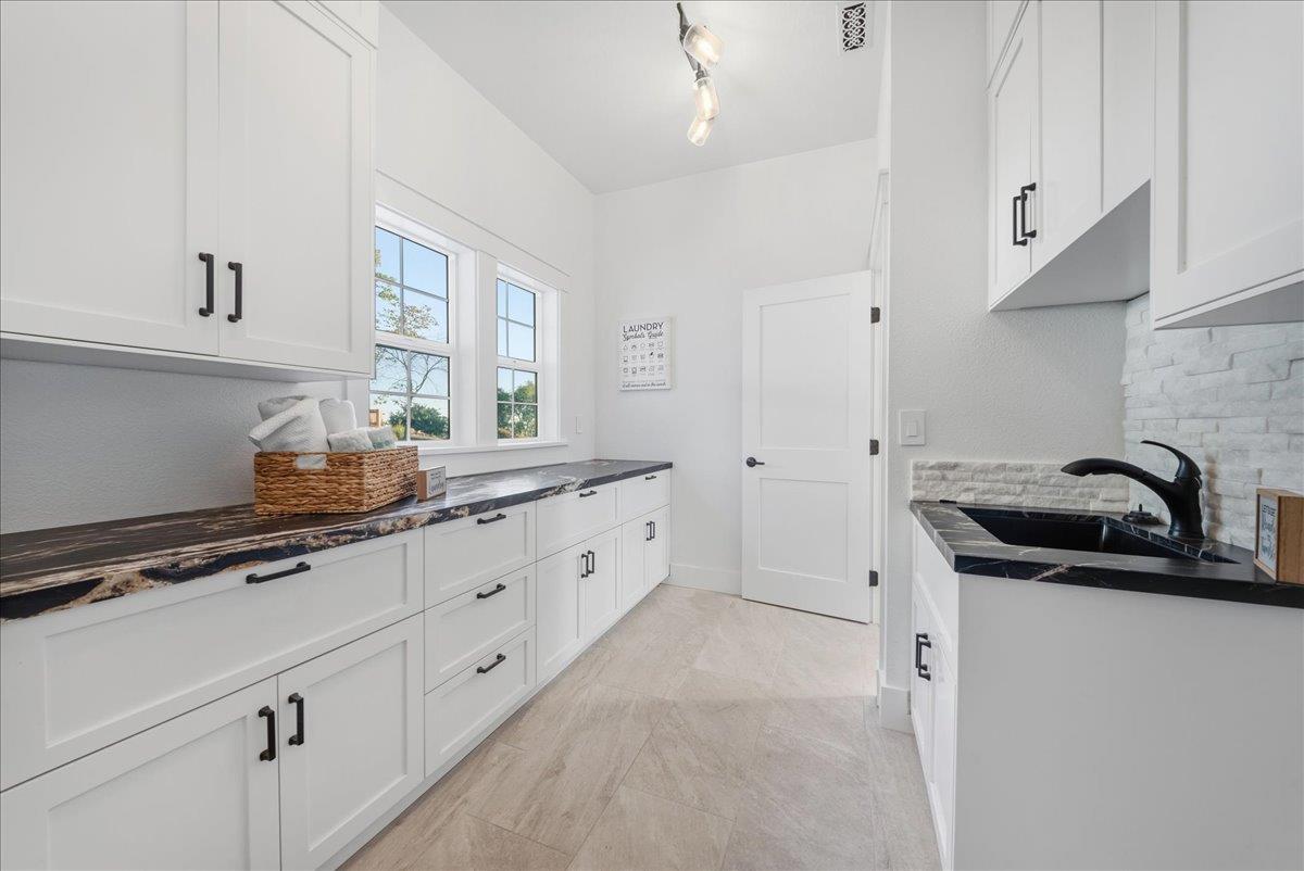 3565 Farview Court Rescue, CA 95672 - Photo 38 of 77 Laundry room is very spacious with lots of storage and sink