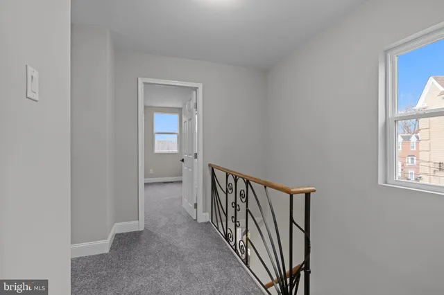 a view of a hallway with windows