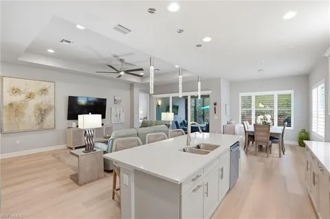 a room with gym equipment and view of living room