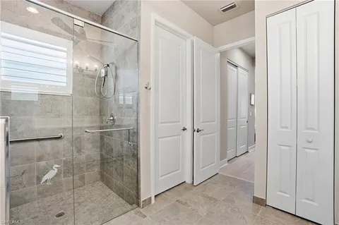 a bathroom with a glass shower door