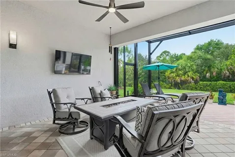 a view of a patio with a table and chairs