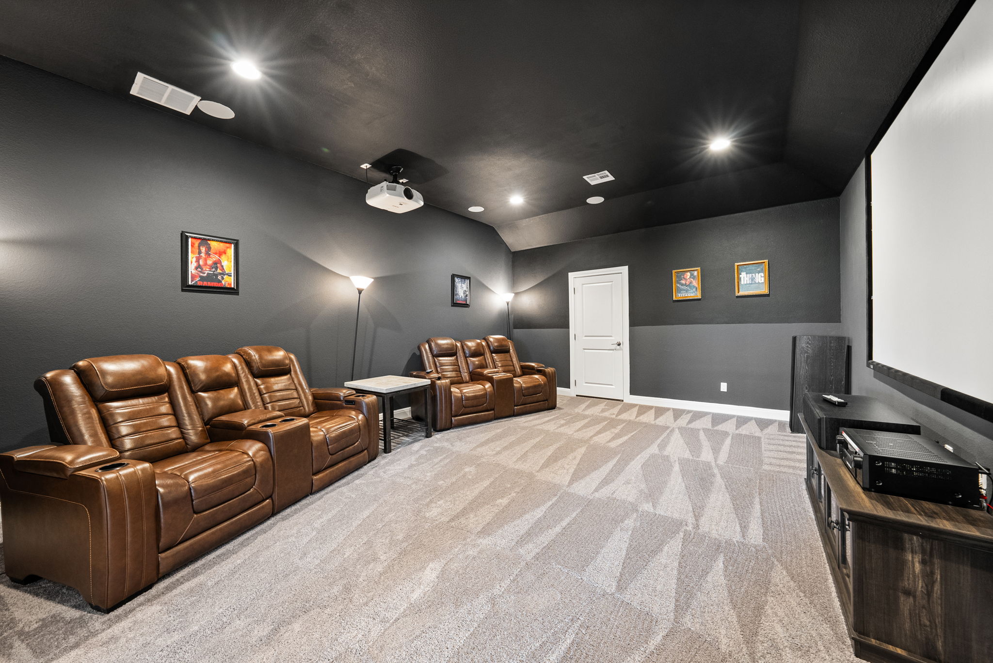 2132 Novara Trail Leander, TX 78641 - Photo 18 of 40 Home theater room with vaulted ceiling, recessed lighting, and light carpet