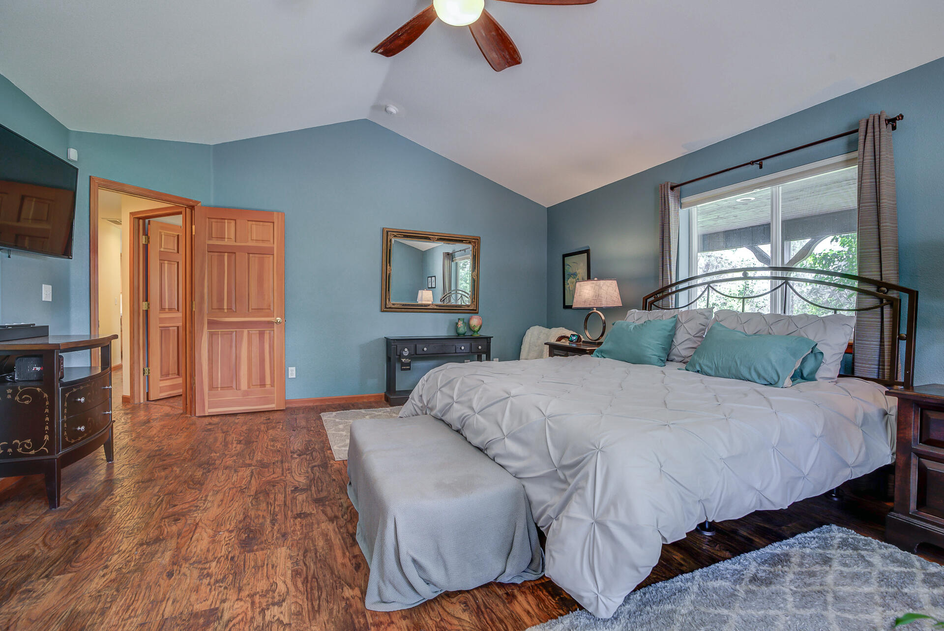 17536 Oly Way Anderson, CA 96007 - Photo 25 of 51 a bedroom with a bed and wooden floor