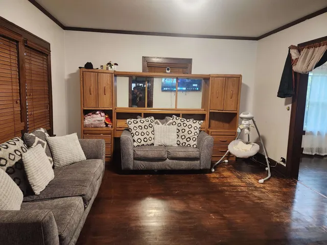 a living room with furniture and a window
