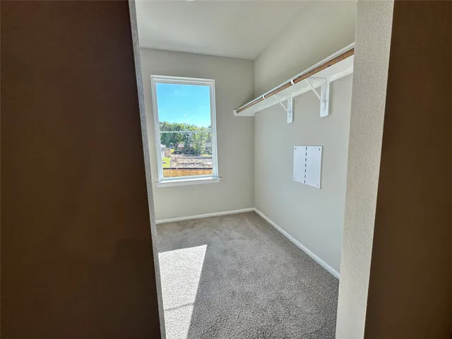 a view of an empty room with windows