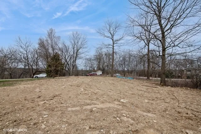 a view of yard covered with snow in front of house