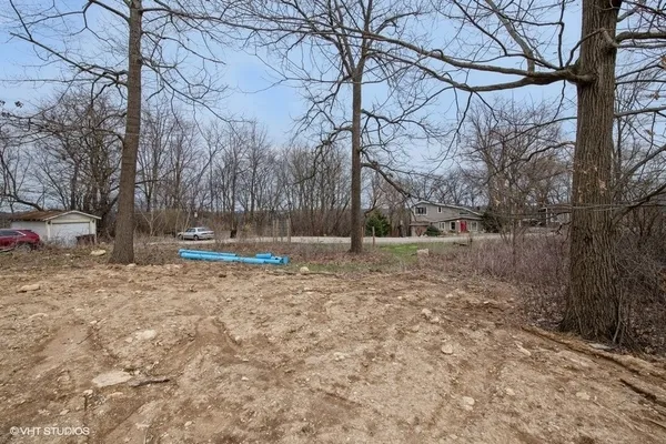 a view of outdoor space with wooden fence