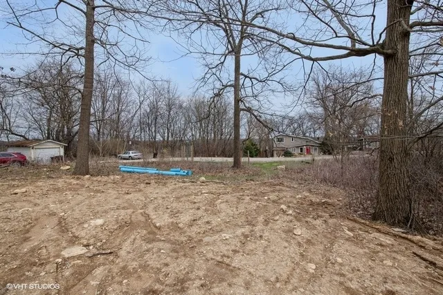 a view of outdoor space with wooden fence