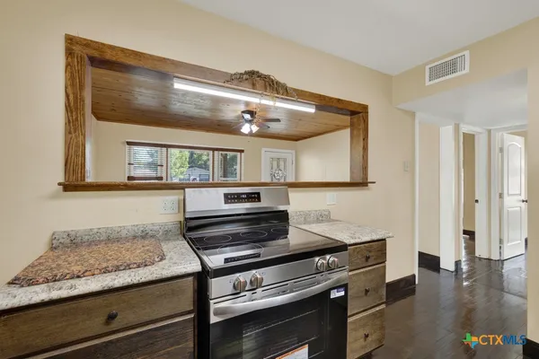 a kitchen with appliances and cabinets