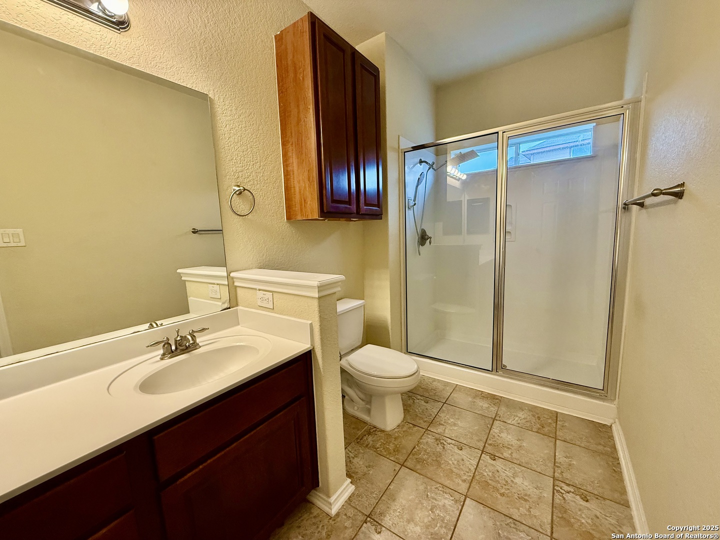 7015 Laguna Beach Converse, TX 78109 - Photo 14 of 39 a bathroom with a sink mirror vanity and toilet