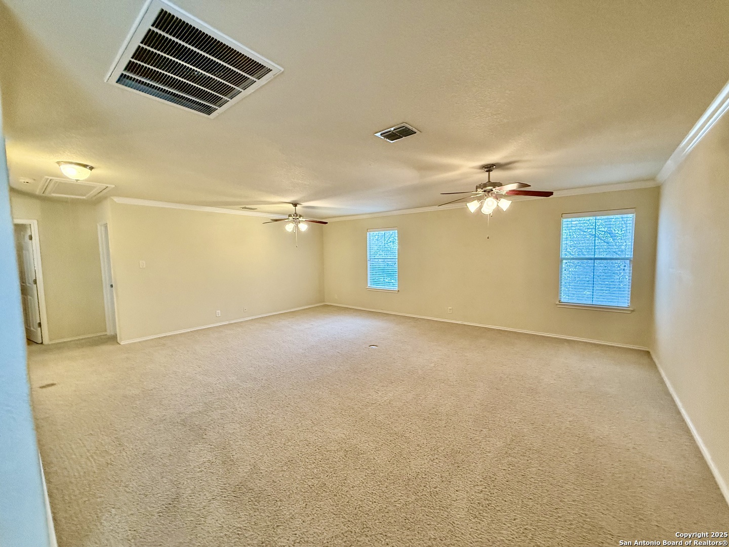 7015 Laguna Beach Converse, TX 78109 - Photo 23 of 39 an empty room with windows and ceiling fan