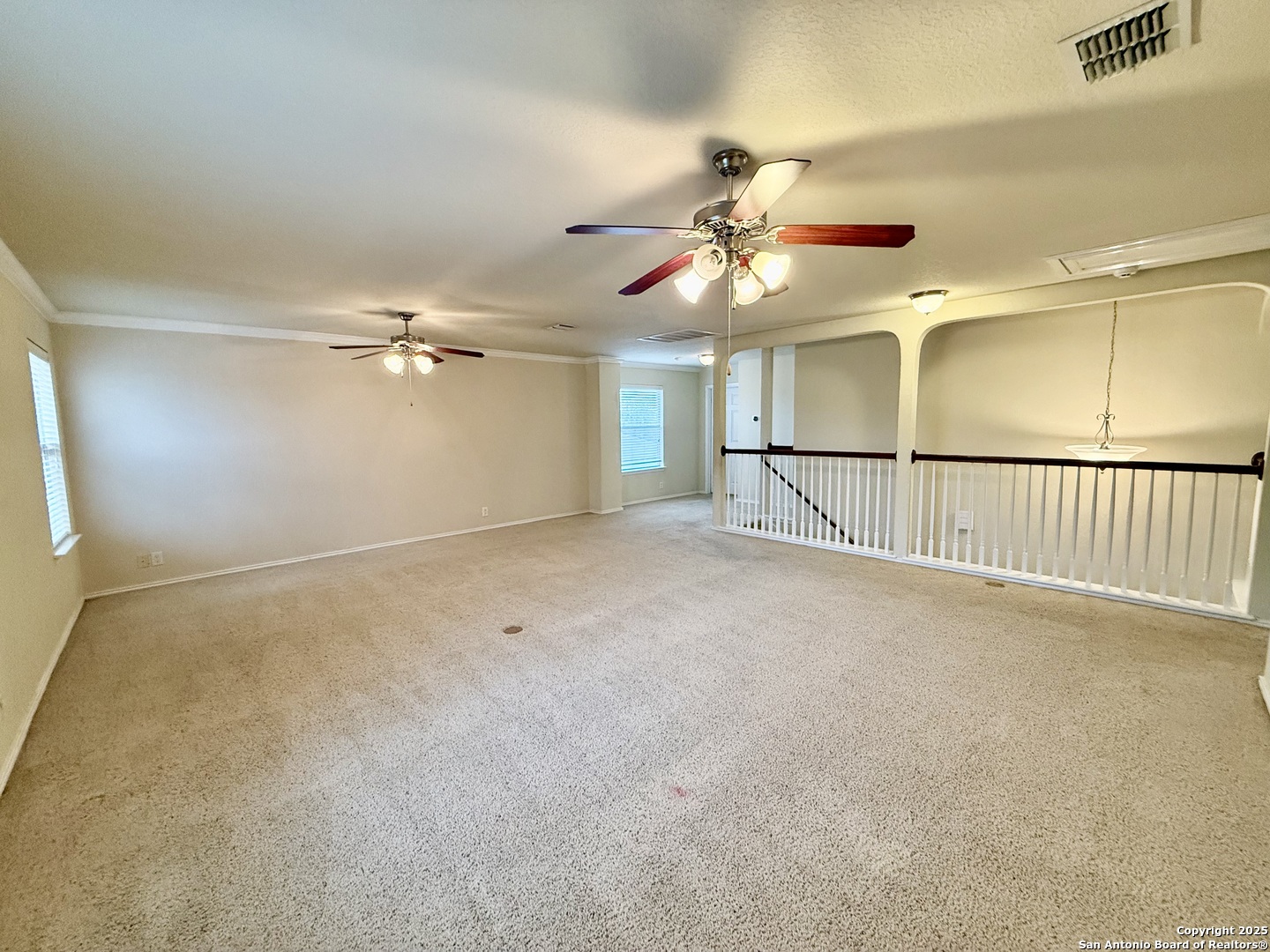 7015 Laguna Beach Converse, TX 78109 - Photo 24 of 39 a view of a livingroom with a ceiling fan and a chandelier fan