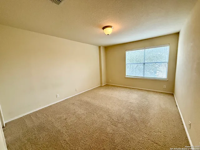 a bathroom with a sink a toilet a mirror and shower