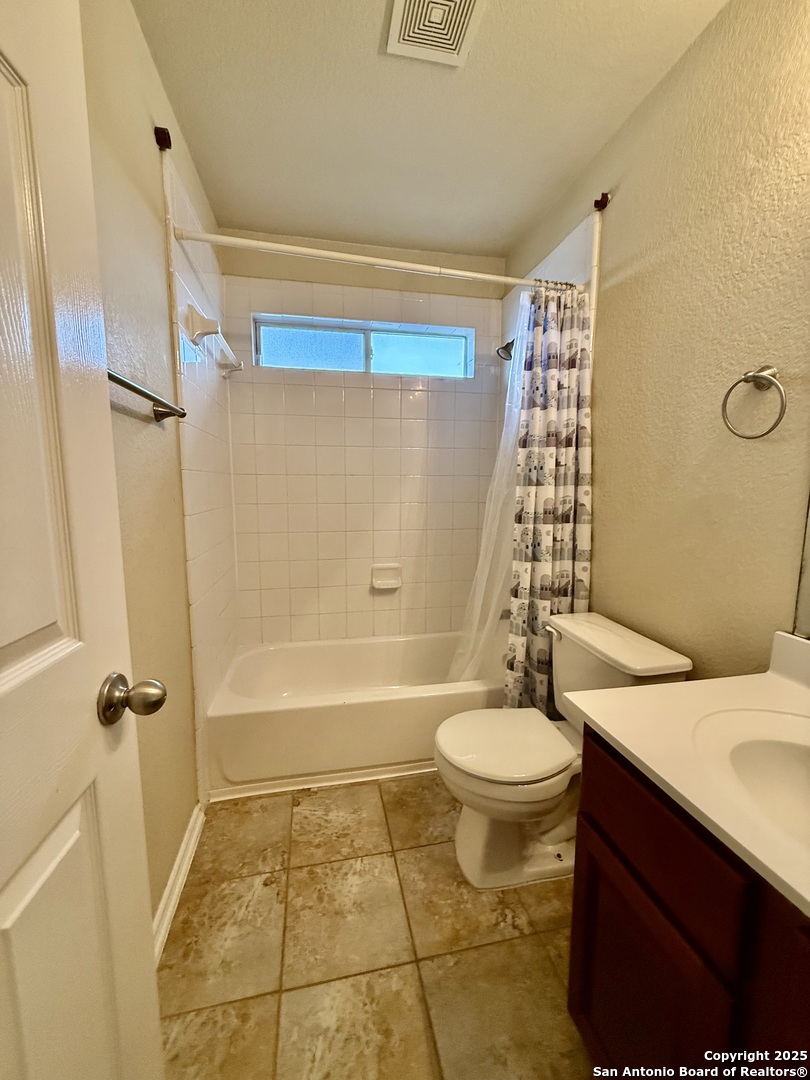 7015 Laguna Beach Converse, TX 78109 - Photo 29 of 39 a bathroom with a sink a toilet a mirror and shower