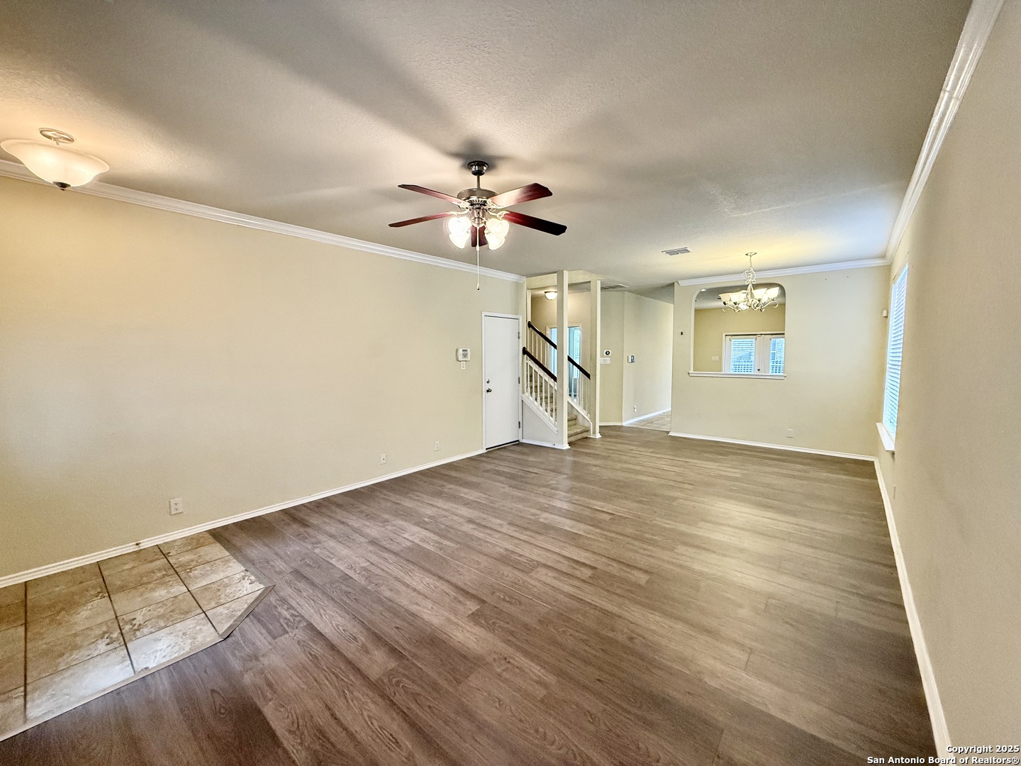 7015 Laguna Beach Converse, TX 78109 - Photo 4 of 39 wooden floor in an empty room with a window