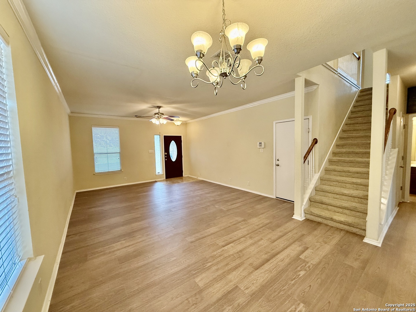 7015 Laguna Beach Converse, TX 78109 - Photo 6 of 39 a view of a livingroom with wooden floor and stairs