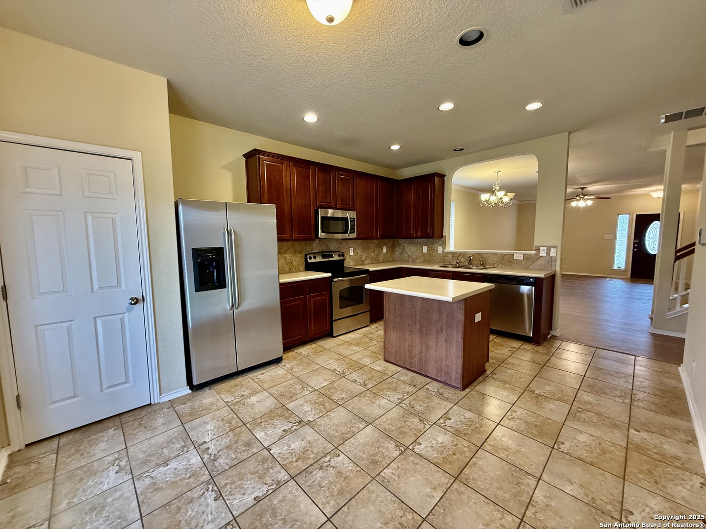 7015 Laguna Beach Converse, TX 78109 - Photo 8 of 39 a kitchen with stainless steel appliances granite countertop a refrigerator and a sink