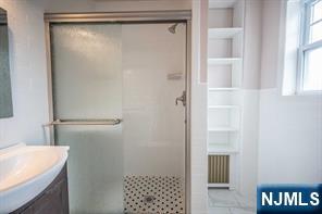 310 Union Street Carlstadt, NJ 07072 - Photo 12 of 24 a bathroom with a shower and a sink