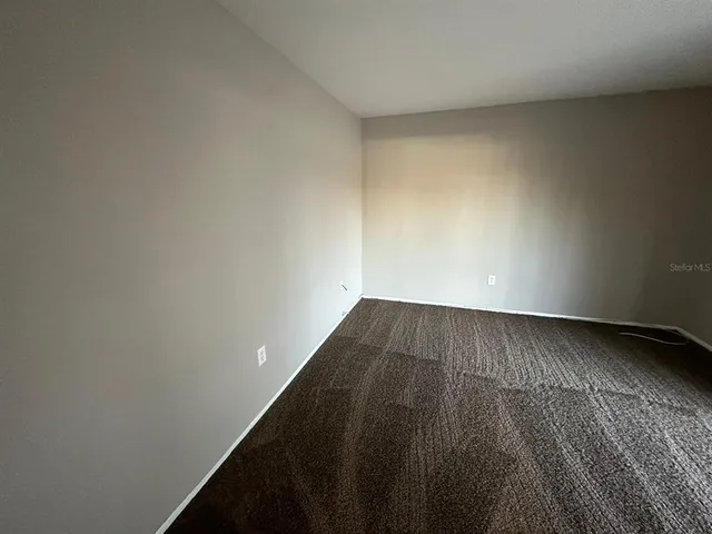 a bathroom with a sink mirror vanity and toilet
