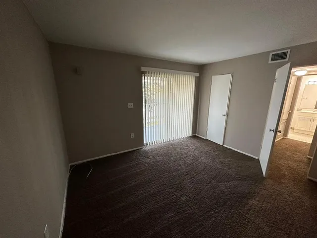 a view of livingroom and hardwood floor