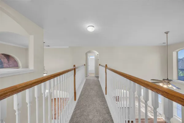 a view of a hallway with staircase