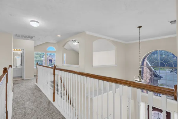 an empty room with windows and entrance