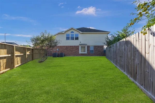 a view of a house with a back yard