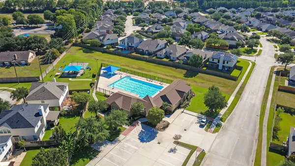 an aerial view of multiple houses with yard