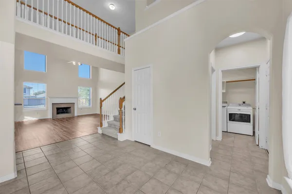 a view of entryway and hall with a living room