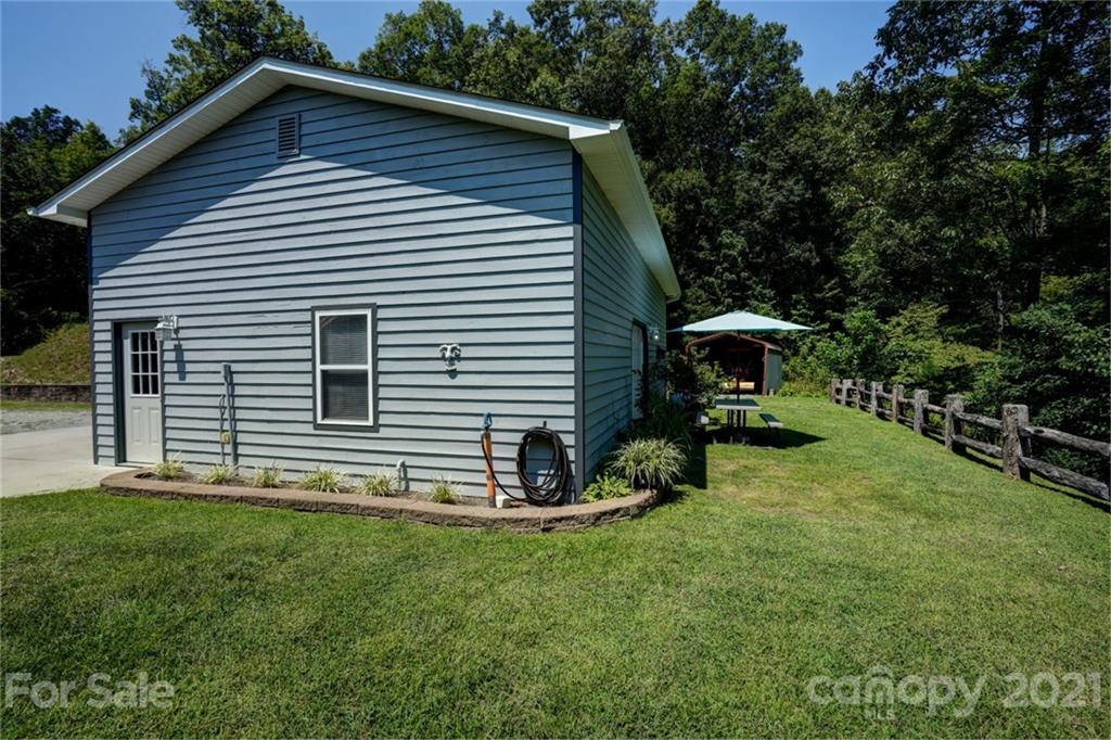 280 Robinson Gap Road Bryson City, NC 28713 - Photo 14 of 36 a view of backyard with a garden and entertaining space